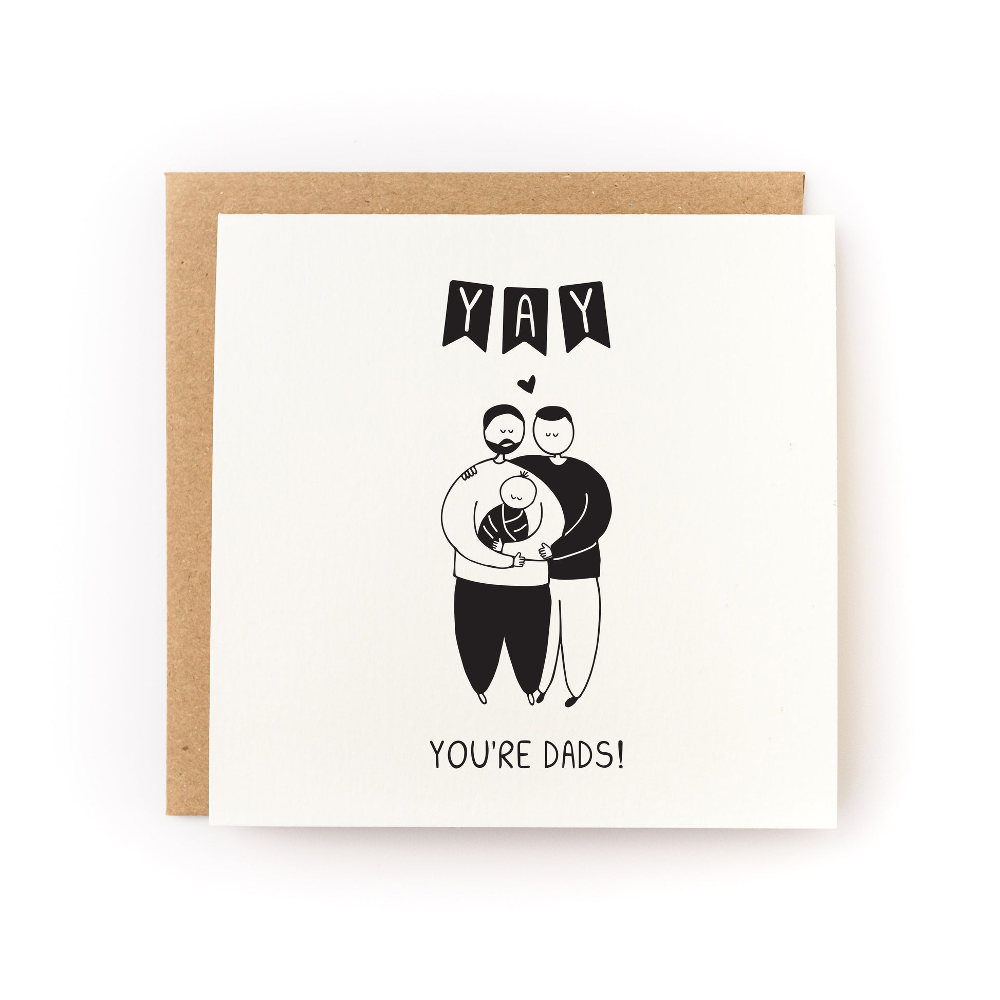 Yay You're Dads Letterpress Card with two dads holding a baby illustration, printed on soft white cardstock.