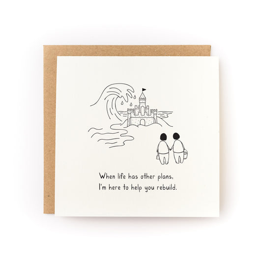 Rebuild Sandcastle Letterpress Card showing two figures with buckets facing a sandcastle and uplifting message below.