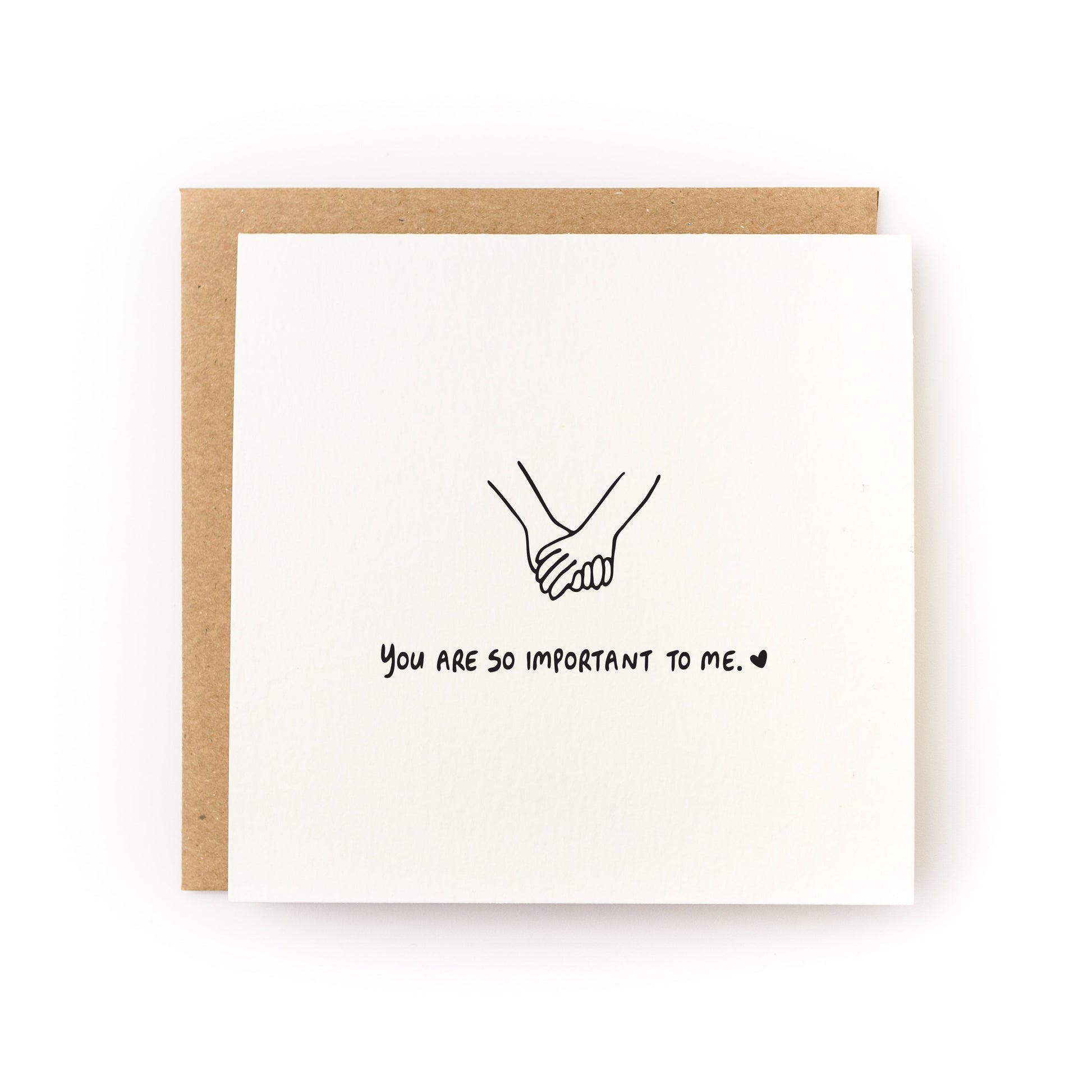 You Are So Important To Me Letterpress Card with hand-drawn holding hands and kraft envelope on white background