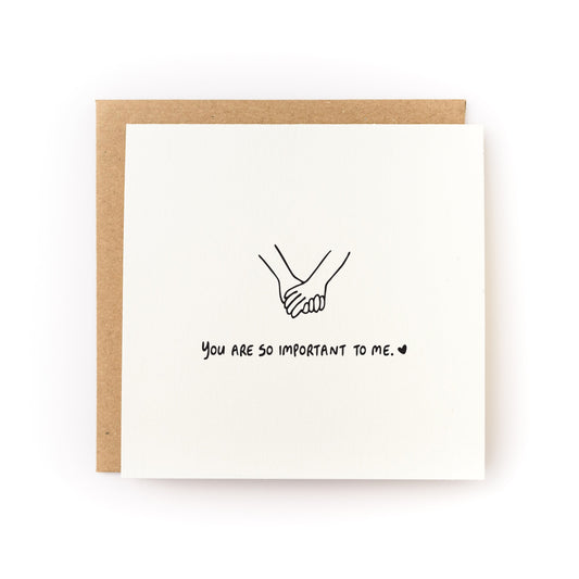 You Are So Important To Me Letterpress Card with hand-drawn holding hands and kraft envelope on white background