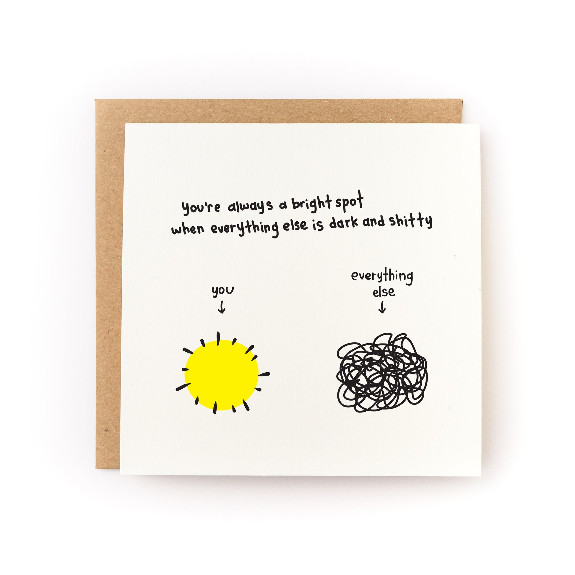 You're A Bright Spot Letterpress Card with hand-drawn sun and scribble, paired with kraft envelope on white cardstock.