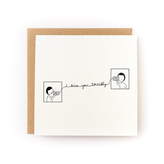 I Miss You Terribly Letterpress Card with two illustrated people connected by a string phone on white card and kraft envelope.