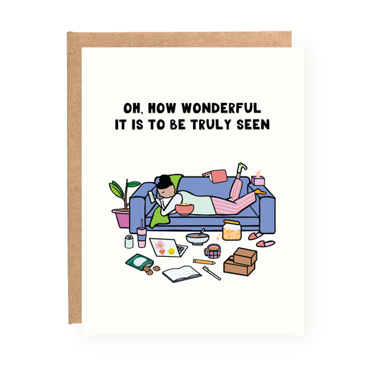 Wonderful to Be Seen Valentine's Day Card showing a person relaxing on a couch surrounded by snacks and books.