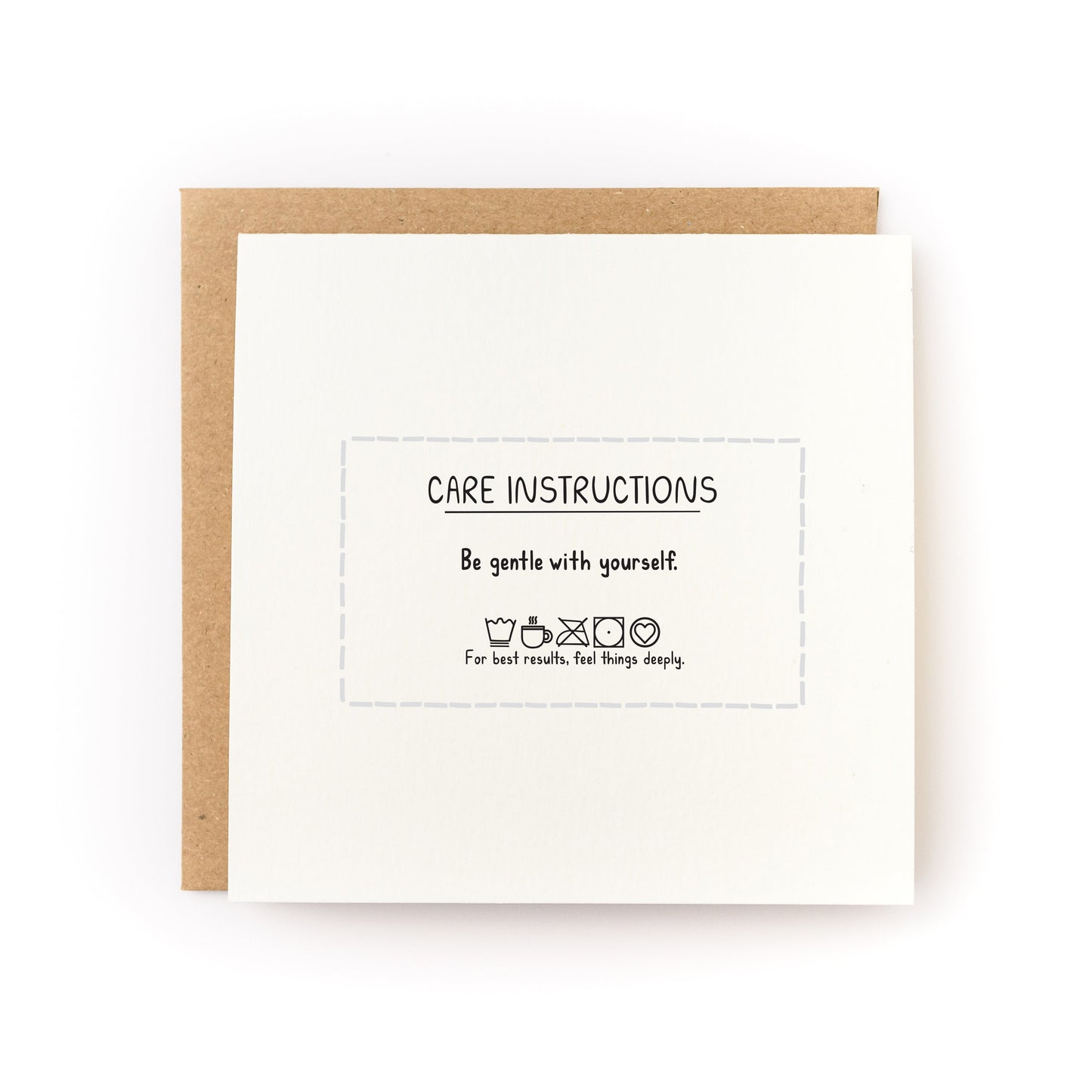 Care Instructions Letterpress Card reading Be gentle with yourself with brown kraft envelope on white background
