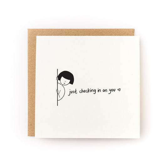 Just Checking In On You Letterpress Card with minimalist design and handwritten text on white cardstock with kraft envelope.