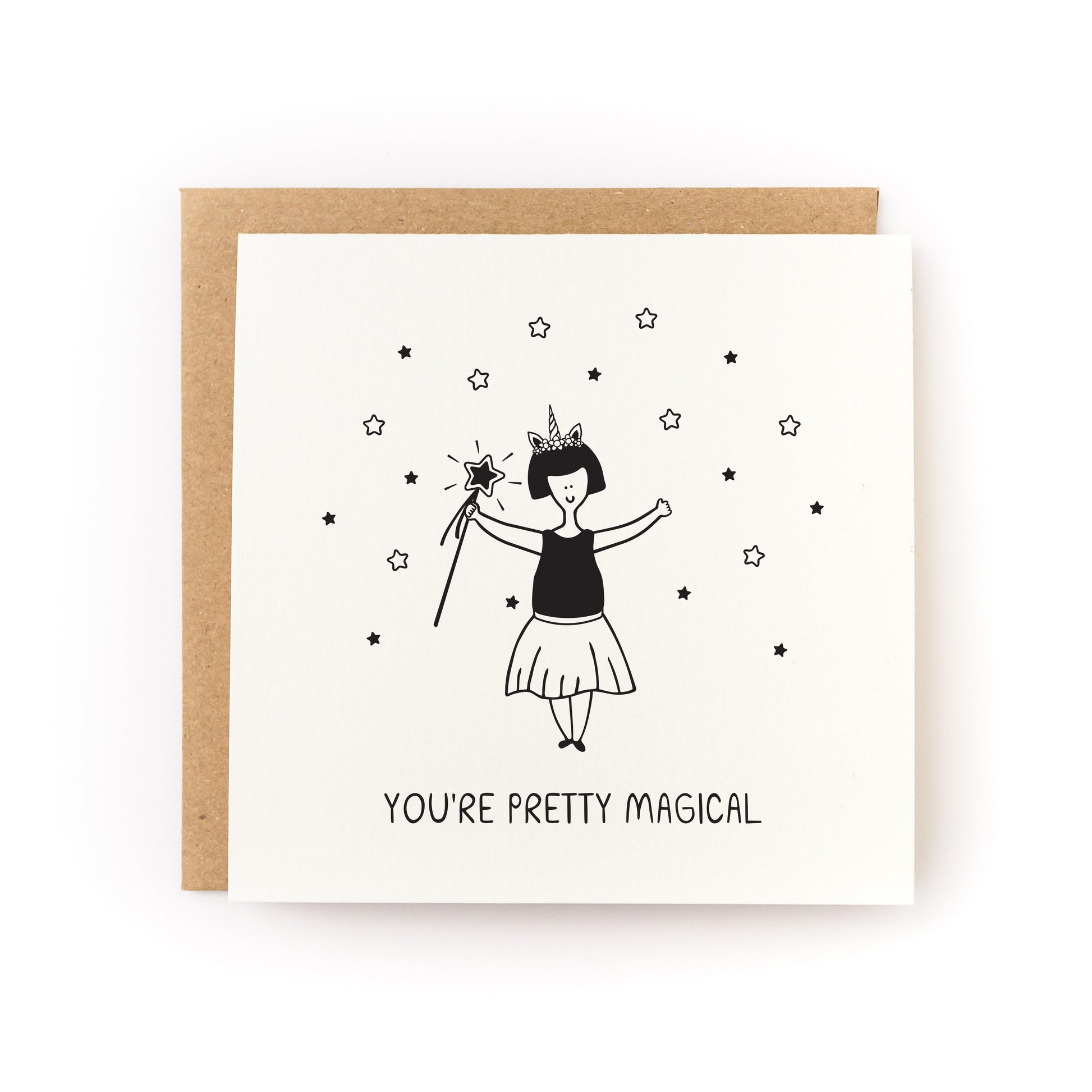 You're Pretty Magical Letterpress Card featuring a hand-printed unicorn girl with stars on white cardstock.