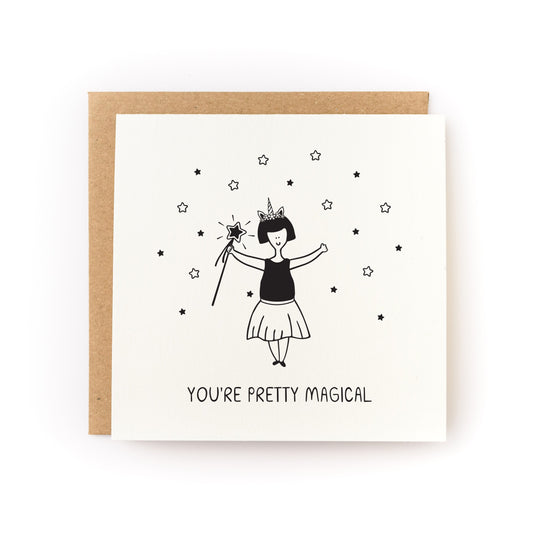You're Pretty Magical Letterpress Card featuring a hand-printed unicorn girl with stars on white cardstock.