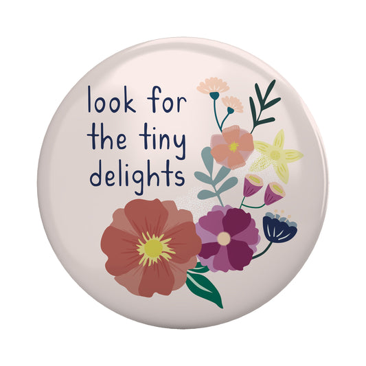 Look for the Tiny Delights Magnet with floral design and uplifting message on a 2.25 inch round metal base magnet.
