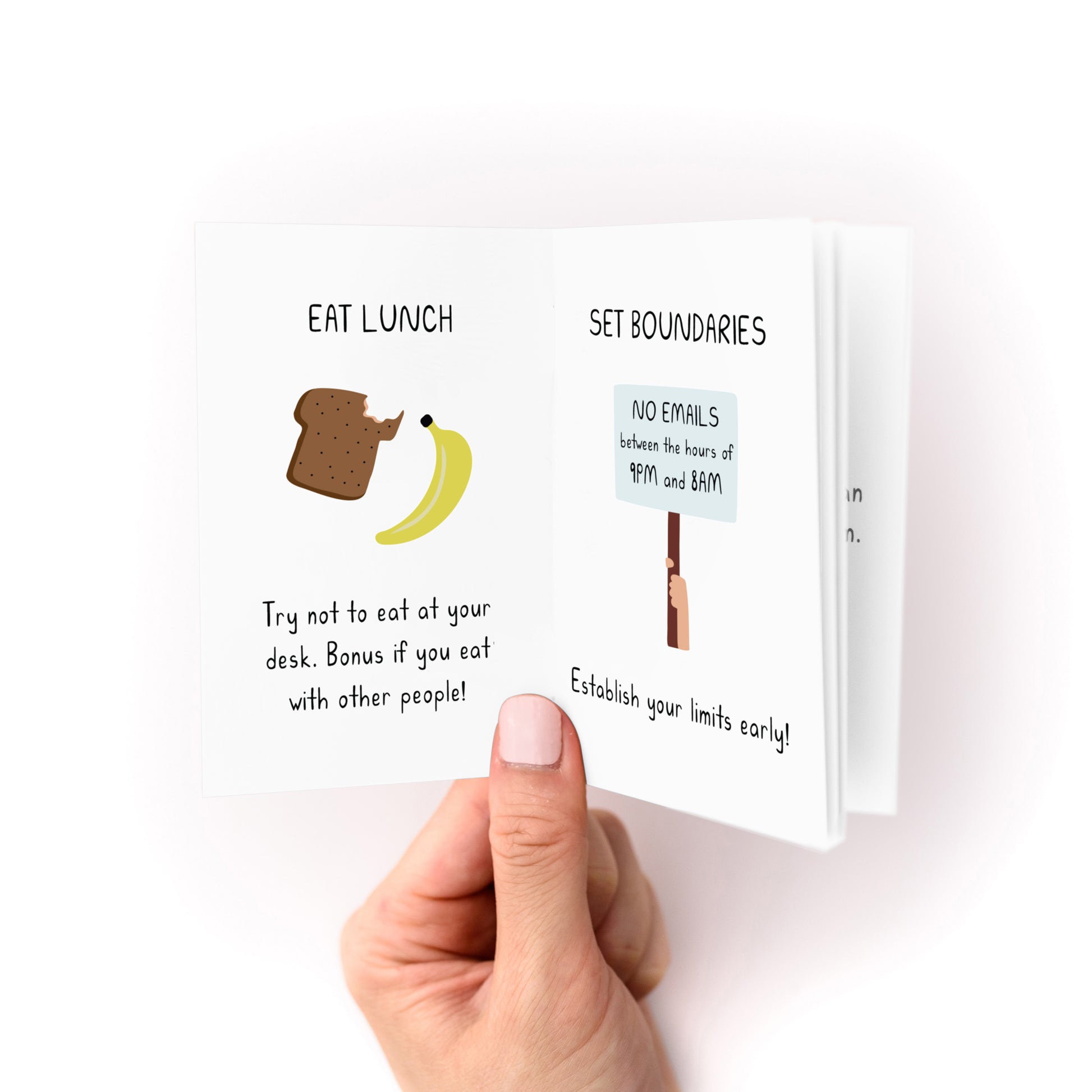 Hand holding Working is Hard Zine open to pages with lunch and boundary setting tips and simple illustrations.