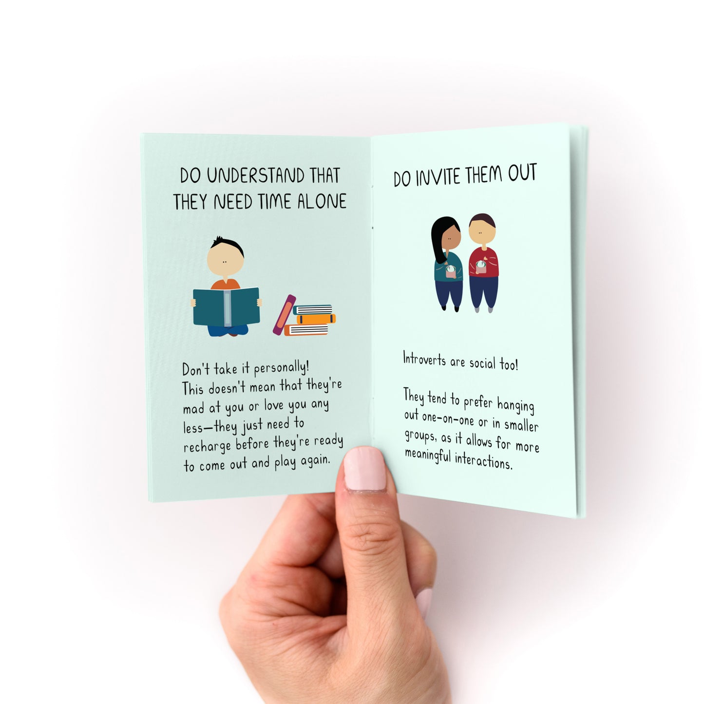 Person holding open "How to Care For Your Introvert Zine" showing advice on understanding and inviting introverts out.