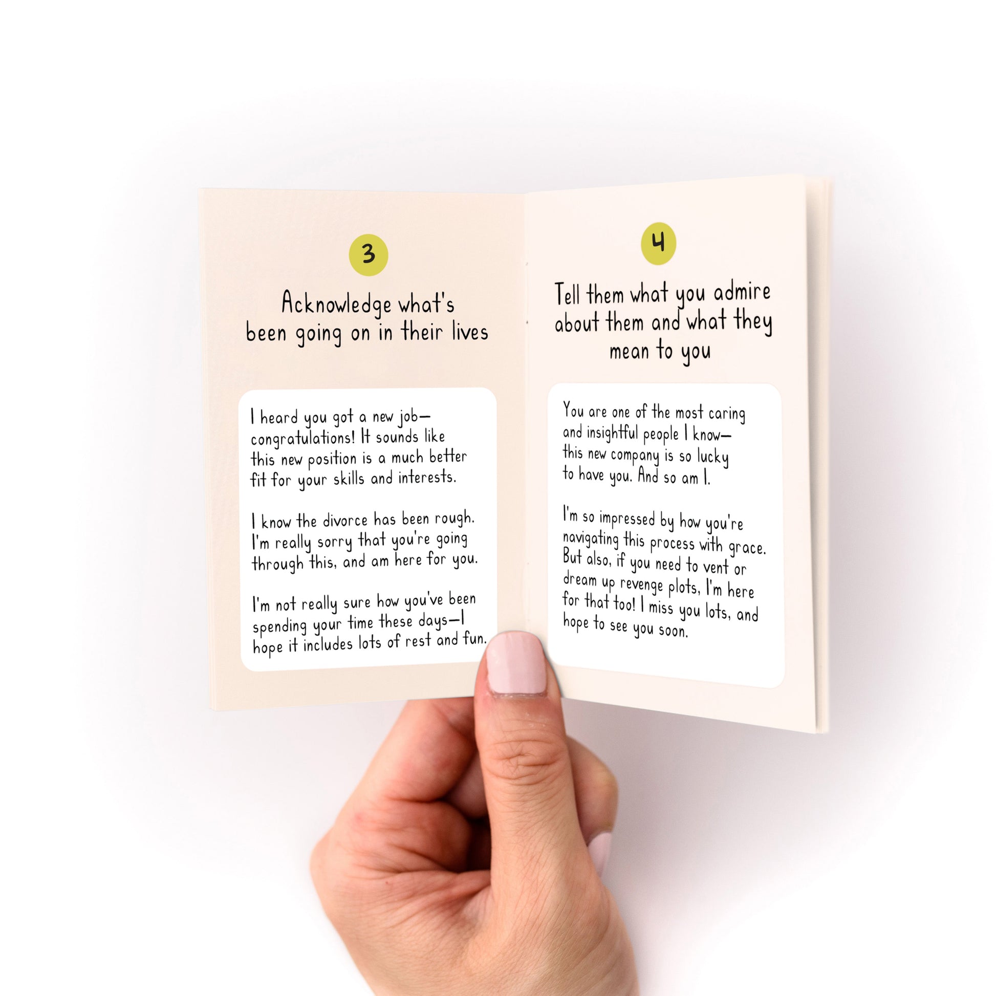 Hand holding open "What to Write in Any Card Zine" showing tips for acknowledging and admiring someone in cards.