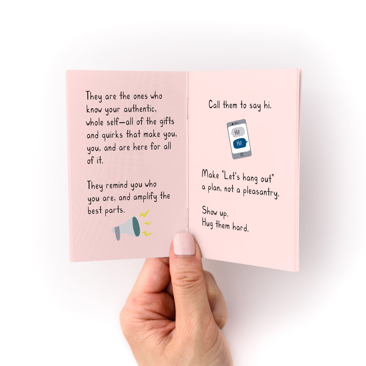 On Belonging (A Tiny Manifesto) Zine open to handwritten text on pink heavy cardstock pages.