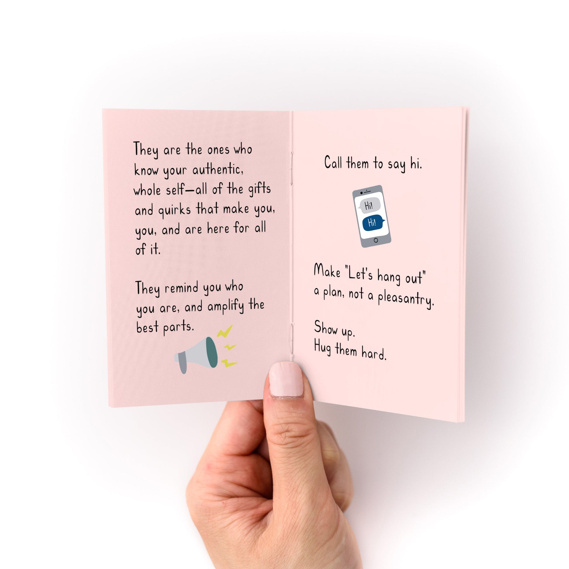 On Belonging (A Tiny Manifesto) Zine open to handwritten text on pink heavy cardstock pages.