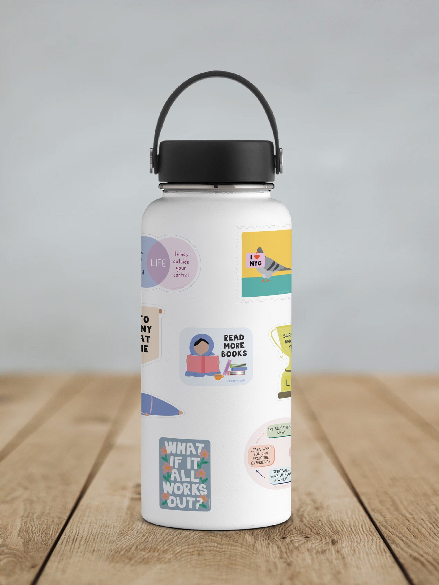 White water bottle with colorful vinyl stickers including one that says "Read More Books" with a person reading and stacked books