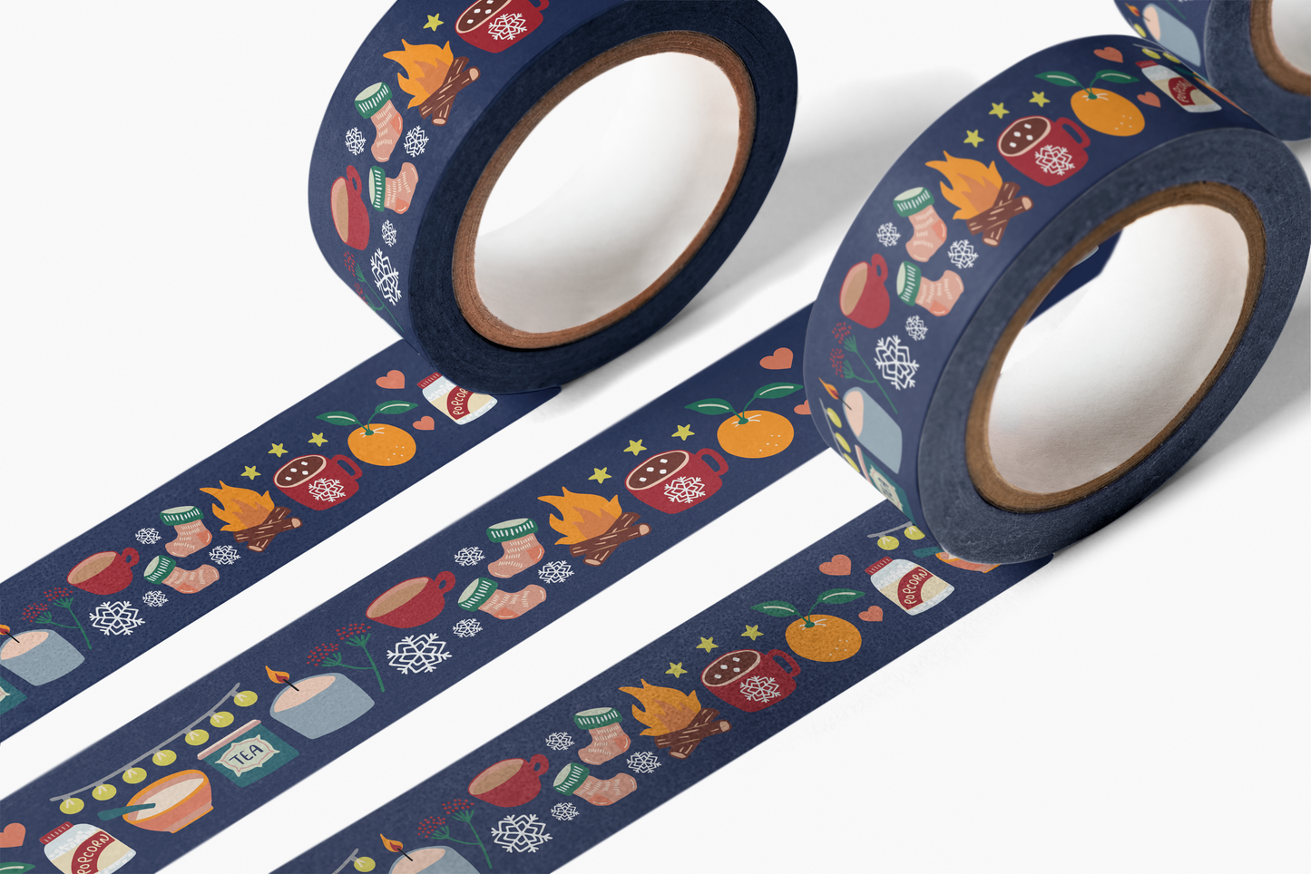 Cozy Winter Washi Tape with illustrated cozy winter items like mugs, oranges, fires, socks on navy blue tape.