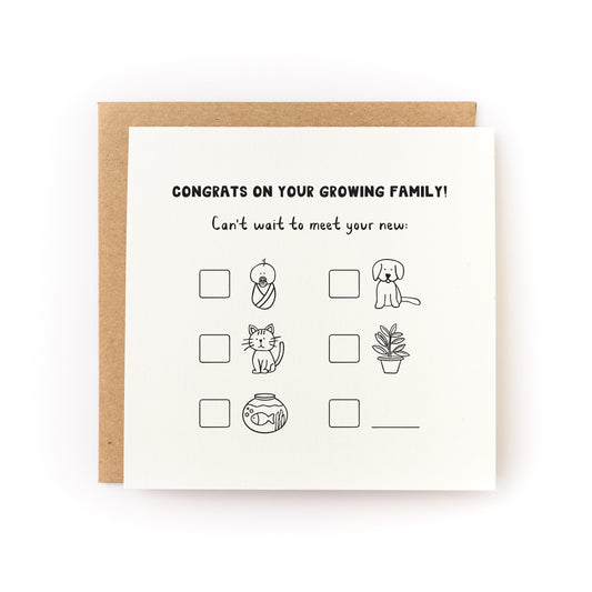 Growing Family Letterpress Card with playful illustrations of baby, pet, plant, and blank boxes to customize.