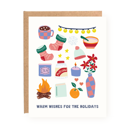 Warm Wishes Holiday Card with cozy holiday icons including mittens, candle, hot drink, and festive decorations.