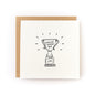 Thoughtful sympathy card or encouragement card for a survivor or anyone who is going through a tough time. The card has a white background and black illustration of a trophy that says, Survived Another Year. 