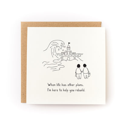 Rebuild Sandcastle Letterpress Card showing two figures with buckets facing a sandcastle and uplifting message below.