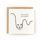 Square white greeting card featuring a minimalist black line drawing of two people holding hands while sitting on a curved line, with the handwritten text "here for all the ups and downs," paired with a brown kraft envelope.