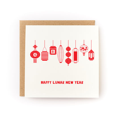 White greeting card featuring a row of red, hand-drawn Asian-style lanterns hanging in various shapes with "Happy Lunar New Year" text below, paired with a brown kraft envelope.