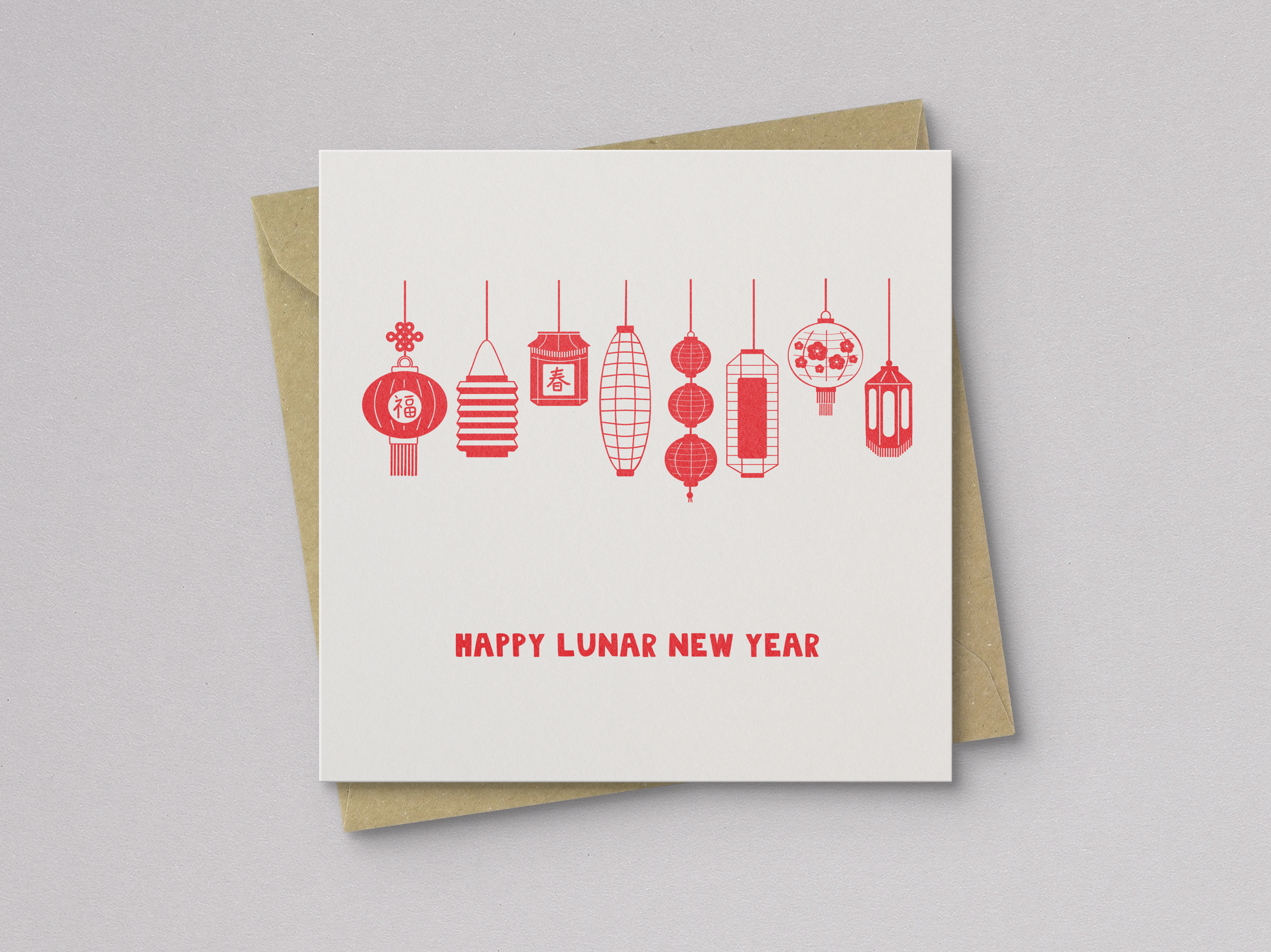 Square greeting card with a simple design of eight red, hand-drawn Asian lanterns hanging in a row above the text "Happy Lunar New Year," paired with a brown kraft envelope.