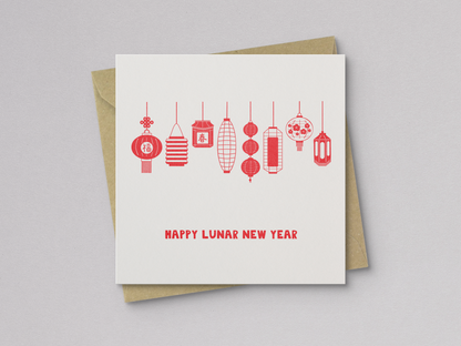 Square greeting card with a simple design of eight red, hand-drawn Asian lanterns hanging in a row above the text "Happy Lunar New Year," paired with a brown kraft envelope.