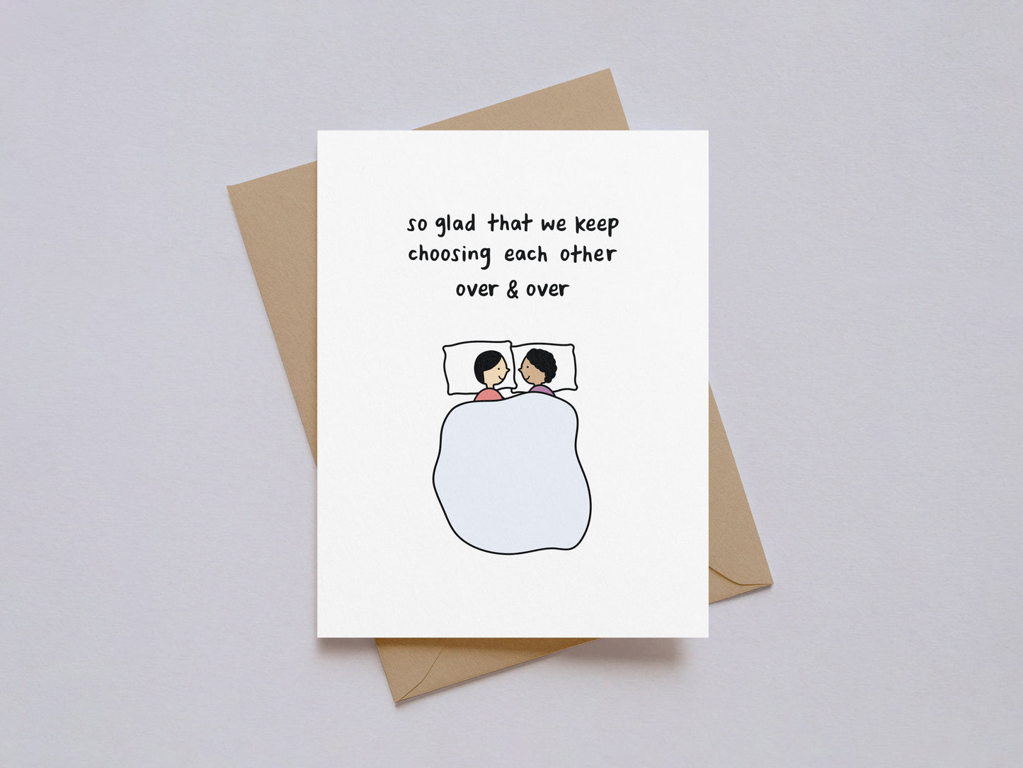 Valentine's Day card with illustration of couple lying in bed and text "so glad that we keep choosing each other over & over