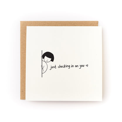 Just Checking In On You Letterpress Card with minimalist design and handwritten text on white cardstock with kraft envelope.