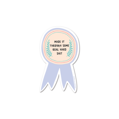 Waterproof and durable vinyl sticker. This motivational sticker has a cute illustration of a medal with the words "Made It Through Some Real Hard Shit" written across it