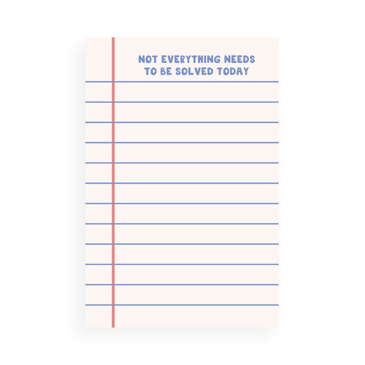Lined notepad page with red margin and blue lines featuring text "Not everything needs to be solved today" at top center