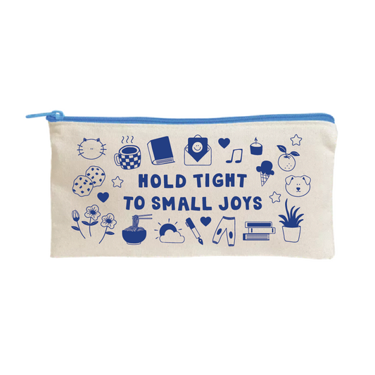 Beige fabric pouch with a blue zipper, featuring blue illustrations including a cat face, coffee cup, book, smiley face envelope, music note, candle, ice cream, fruit, dog face, flowers, noodles, sun, paintbrush, pants, books, and a potted plant, surrounding the phrase "Hold Tight to Small Joys.