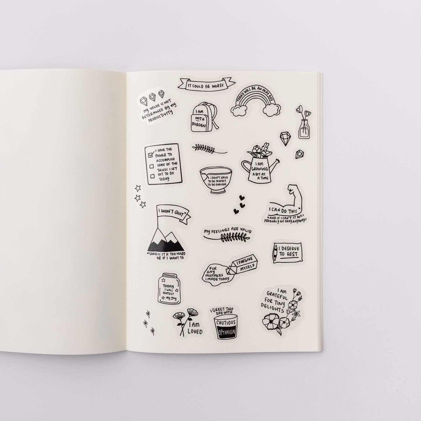 Cute sticker sheet with positive affirmation stickers, which have motivational illustrations that say things like I Am Loved and My Value Is Not Determined By My Productivity. The stickers have black and white illustrations printed on a transparent background.