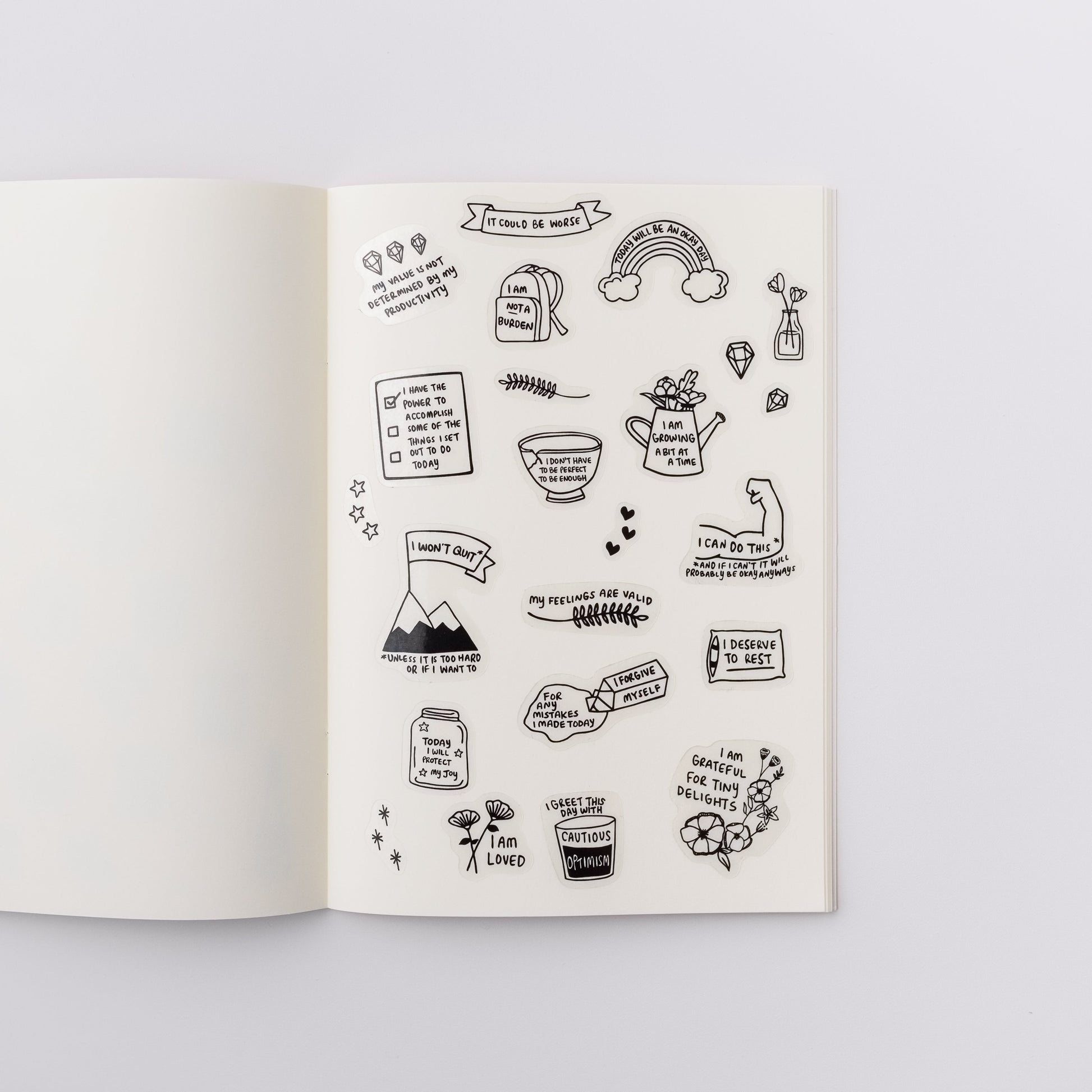 Cute sticker sheet with positive affirmation stickers, which have motivational illustrations that say things like I Am Loved and My Value Is Not Determined By My Productivity. The stickers have black and white illustrations printed on a transparent background.