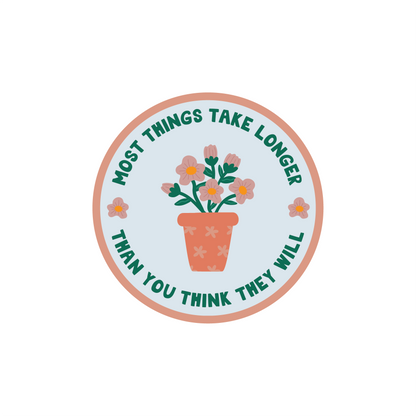 Things Take Longer Sticker with floral design and quote "Most things take longer than you think they will" in circle shape.