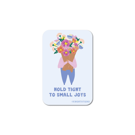 Illustrated matte vinyl sticker of person holding colorful bouquet with text "Hold Tight to Small Joys" on light background