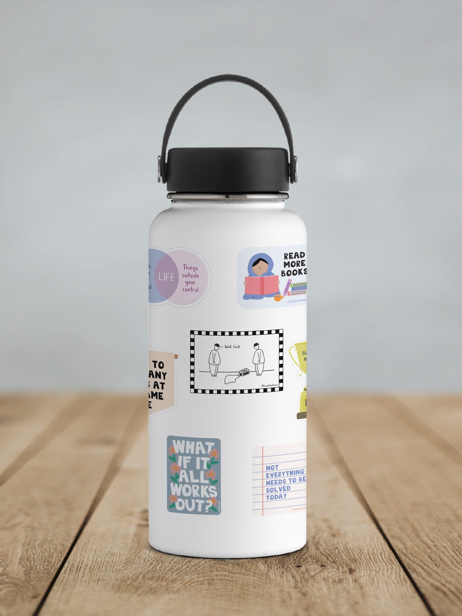 White water bottle with a black lid and handle, decorated with various colorful and black-and-white stickers including a cartoon of two figures near spilled milk with the text "well, fuck" inside a checkered border.