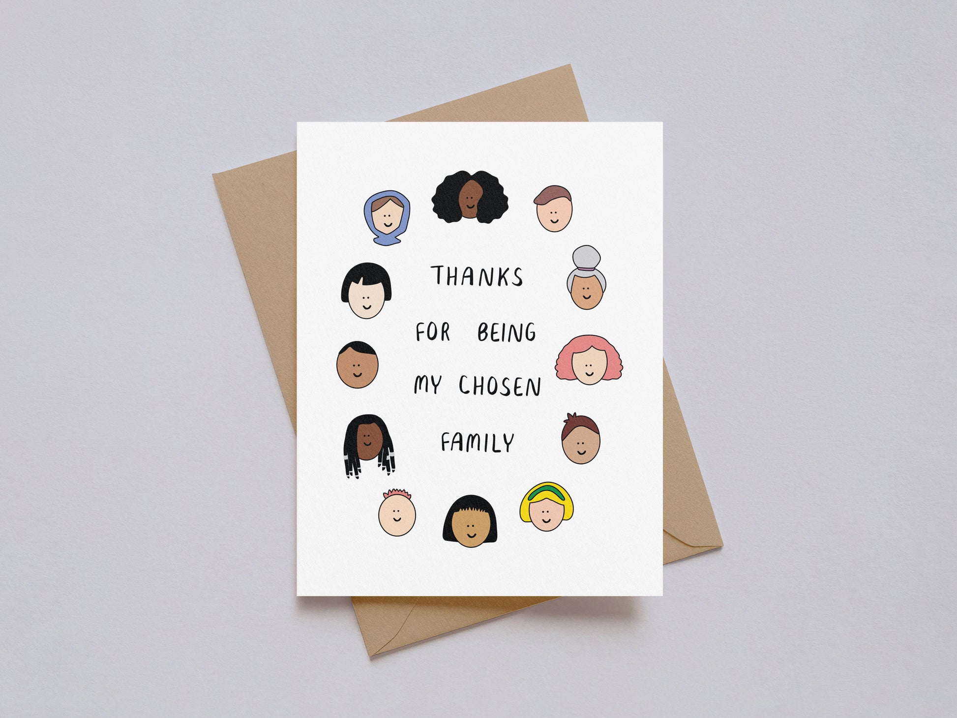 Thank You card with diverse illustrated faces surrounding the text "Thanks for being my chosen family" on white background