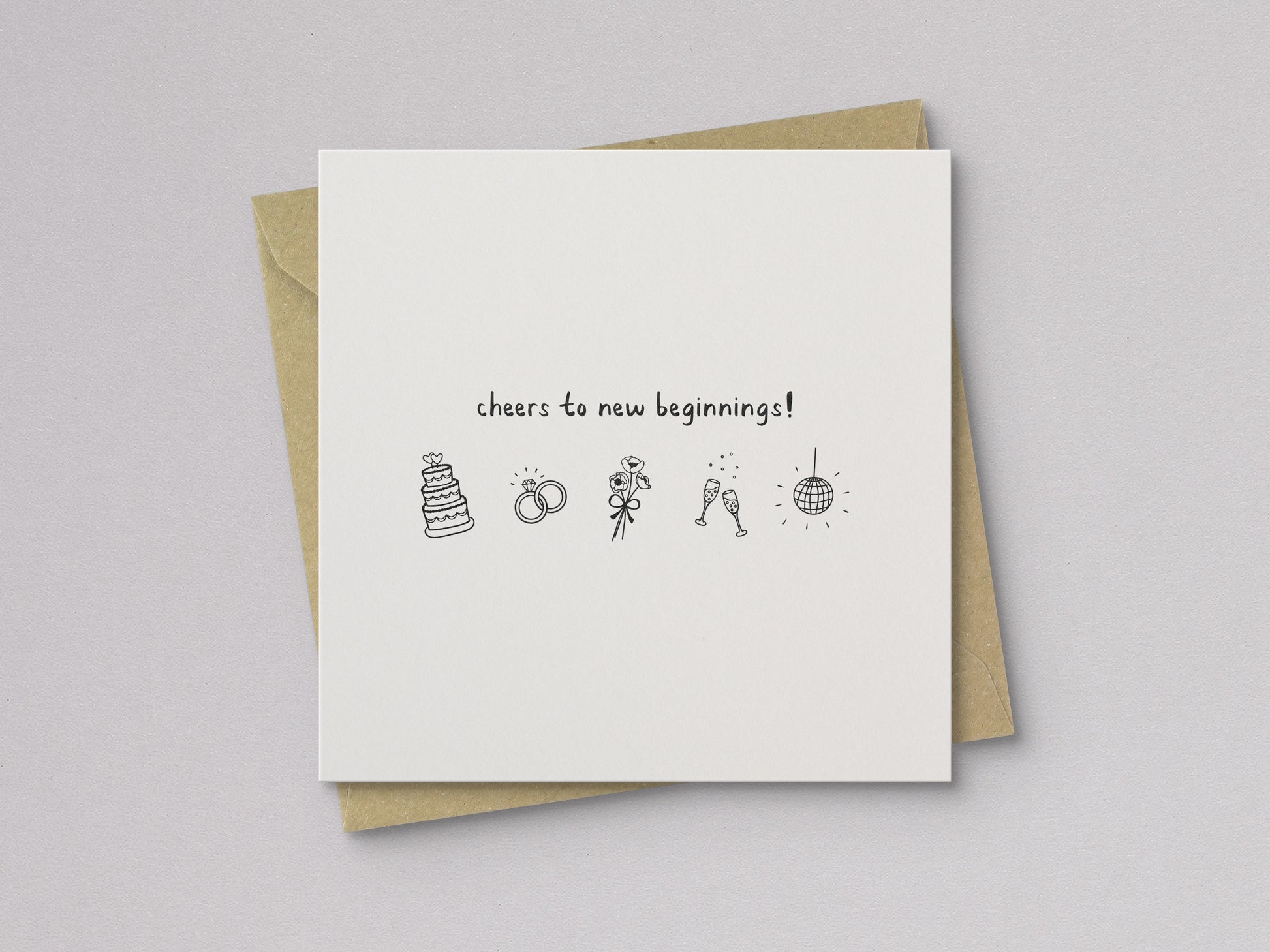 Folded wedding card with simple black illustrations including cake, rings, bouquet, clinking glasses, and disco ball on white background